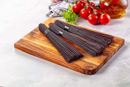 Raw black rice noodles lines pastaの写真素材