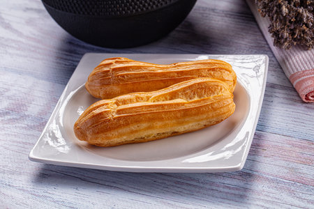 Sweet baked eclair dessert with custard cream
