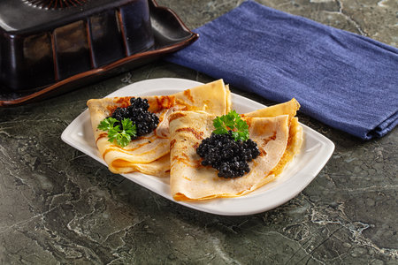 luxury pancake with strugeon black caviarの写真素材