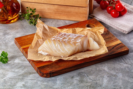 Raw cod fish fillet for cooking over board