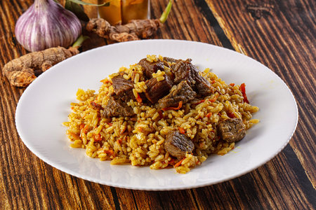 Asian traditional pilaf with beef and carrot