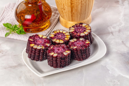 Ripe boiled black corn maize garnishの写真素材