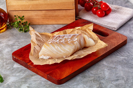 Raw cod fish fillet for cooking over board