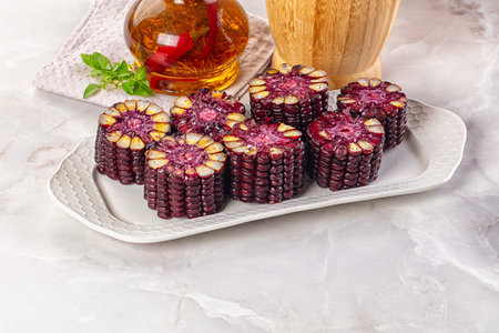 Ripe boiled black corn maize garnishの写真素材