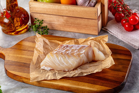 Raw cod fish fillet for cooking over board