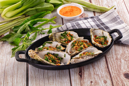 Grilled oysters with green onion and peanut