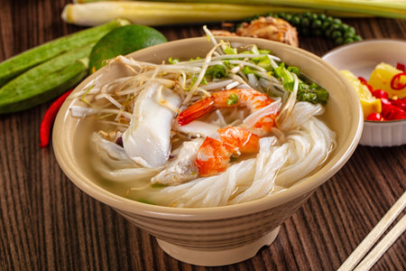 Vietnamese soup Pho with seafood - prawn and calamari