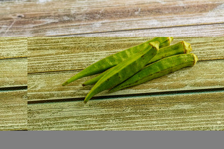 Raw organic green okra vegetable for vegan cuisine