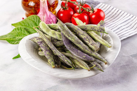 Raw green bean strips heap in the bowl