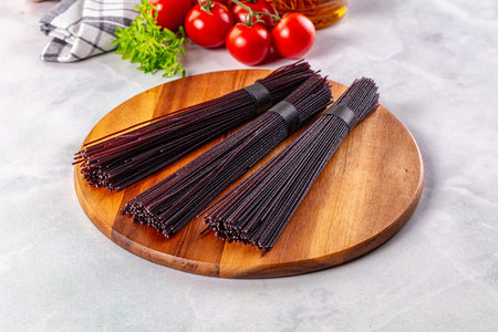 Raw black rice noodles lines pastaの写真素材