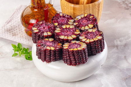 Ripe boiled black corn maize garnishの写真素材