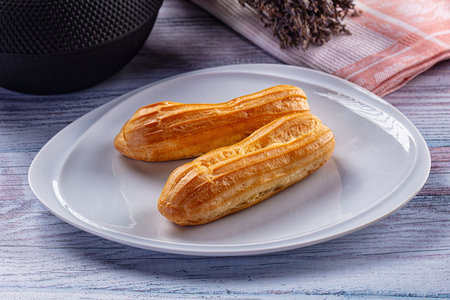 Sweet baked eclair dessert with custard cream