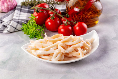 Canned marinated squid rings heap snack appetizerの写真素材