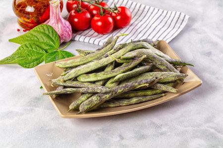 Raw green bean strips heap in the bowl