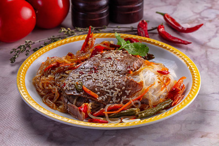 Asian funchosa noodles with beef in oyster sauceの写真素材