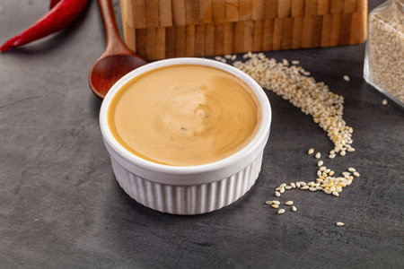 Asian sesame sauce dip with seeds for salad