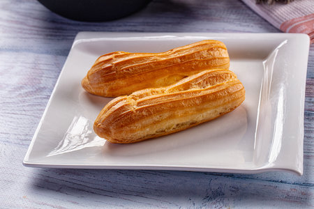 Sweet baked eclair dessert with custard cream