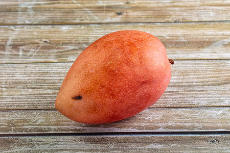 Whole ripe sweet tropical red mango fruit