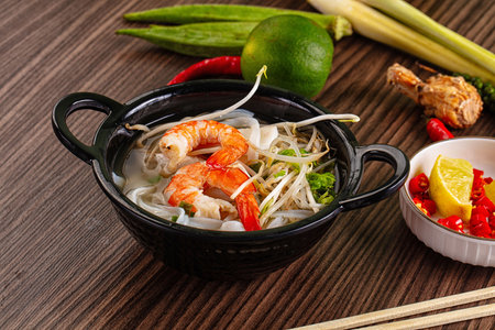 Vietnamese soup Pho with seafood - prawn and calamari
