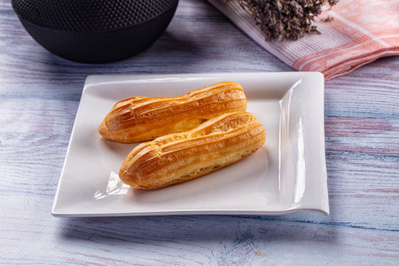 Sweet baked eclair dessert with custard cream