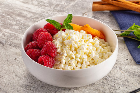 Grain cottage - curd - cheese with raspberriesの写真素材