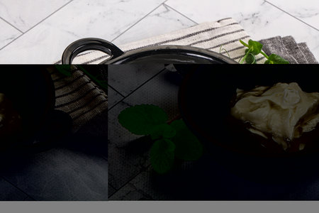 Traditional soft dietary Greek yoghurt served mint leaves