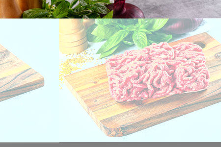 Raw minced beef meat over board for cooking