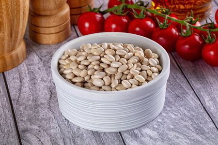 Raw white beans for cooking in the bowl