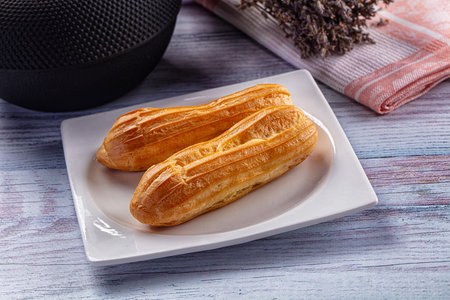 Sweet baked eclair dessert with custard cream
