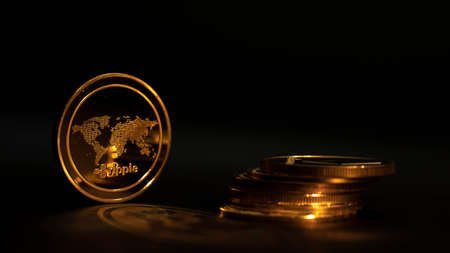 Crypto coin Ripple XRP in black background with another coins. Gold light.の写真素材