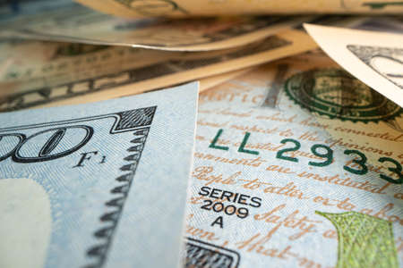 Macro shot of dollars. Stack of one hundred dollar bills close-up.