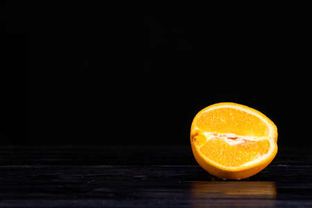 Half of the beautifully retouched orange fruit. Summer mood. healthの写真素材