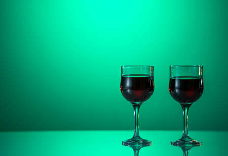 Red Wine in glasses on the green backgroundの写真素材