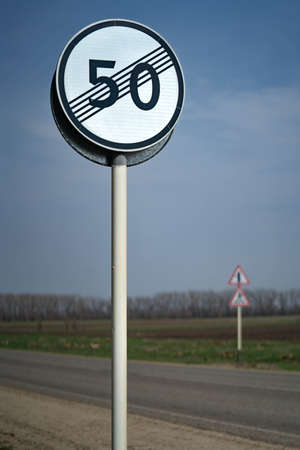 Speed limit zone ends sign on white background with clipping. Traffic signs. Spanish traffic signal: end of speed limited to 50 km per hour. rawの写真素材