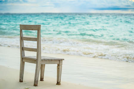 Blue ocean white sand beach nature tropical palms Island. Caribbean sea and sky. Small wild beach chairs. landscape Island. Palms turquoise sea background Atlantic ocean.の写真素材