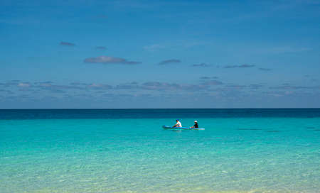 Tropical Beach and Palm trees of Bali. 4k, Island trip. White Sand Beach vacation, Caribbean turquoise Sea water, Palm trees relaxation outdoor landscape, Punta Cana, Dominican Republic, coast shoreのeditorial素材