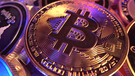 Macro Bitcoin BTC with gold and blue neon light with many reflections. Halving. Mining....