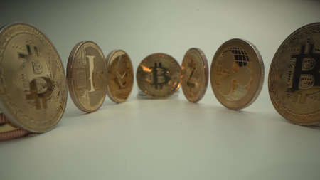 Many popular crypto coins as Bitcoin BTC, Etherium ETH, ZCASH ZEC, Ripple XRP, Litecoin. BTC in the middle as main currency. Halving time. Macro shot from Laowa 24mmの写真素材
