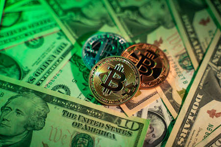 US Dollar and Digital money Bitcoin coin Put together. Concept of digital money is becoming a competitor in major currencies such as the dollar.の写真素材