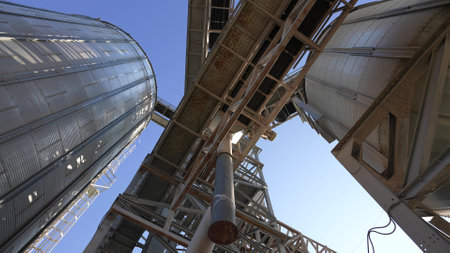 agricultural industry. tanks for processing and storage of soybean and wheat grain. Harvesting and processing and storage elevator. 4k footageの写真素材