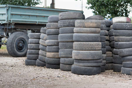old trailer and old tires at the dumpの写真素材