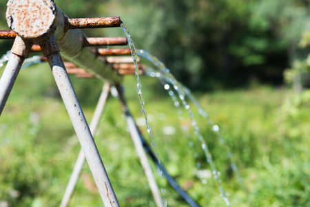 irrigation system in the summer in the sunの写真素材
