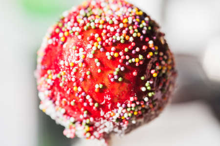 the apples in glaze sprinkled with colored grainsの写真素材