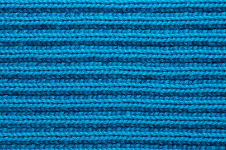 the background is made of knitted woolen fabric closeup