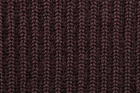 the background is made of knitted woolen fabric closeup