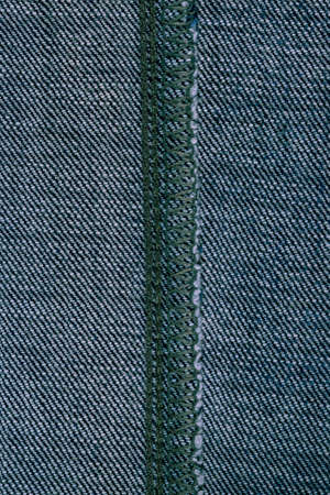 background of denim close-up finishes and decorative stitchingの写真素材