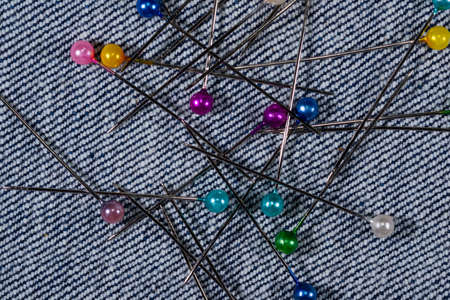 sewing accessories on the background of denim closeupの写真素材