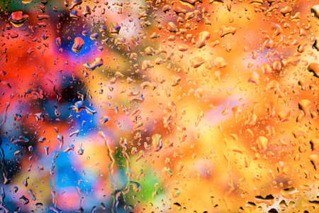 bright abstract background of water drops on glass