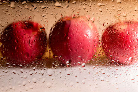 bright abstract background of water drops on glassの写真素材