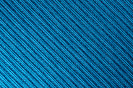 the background is made of knitted woolen fabric closeup
